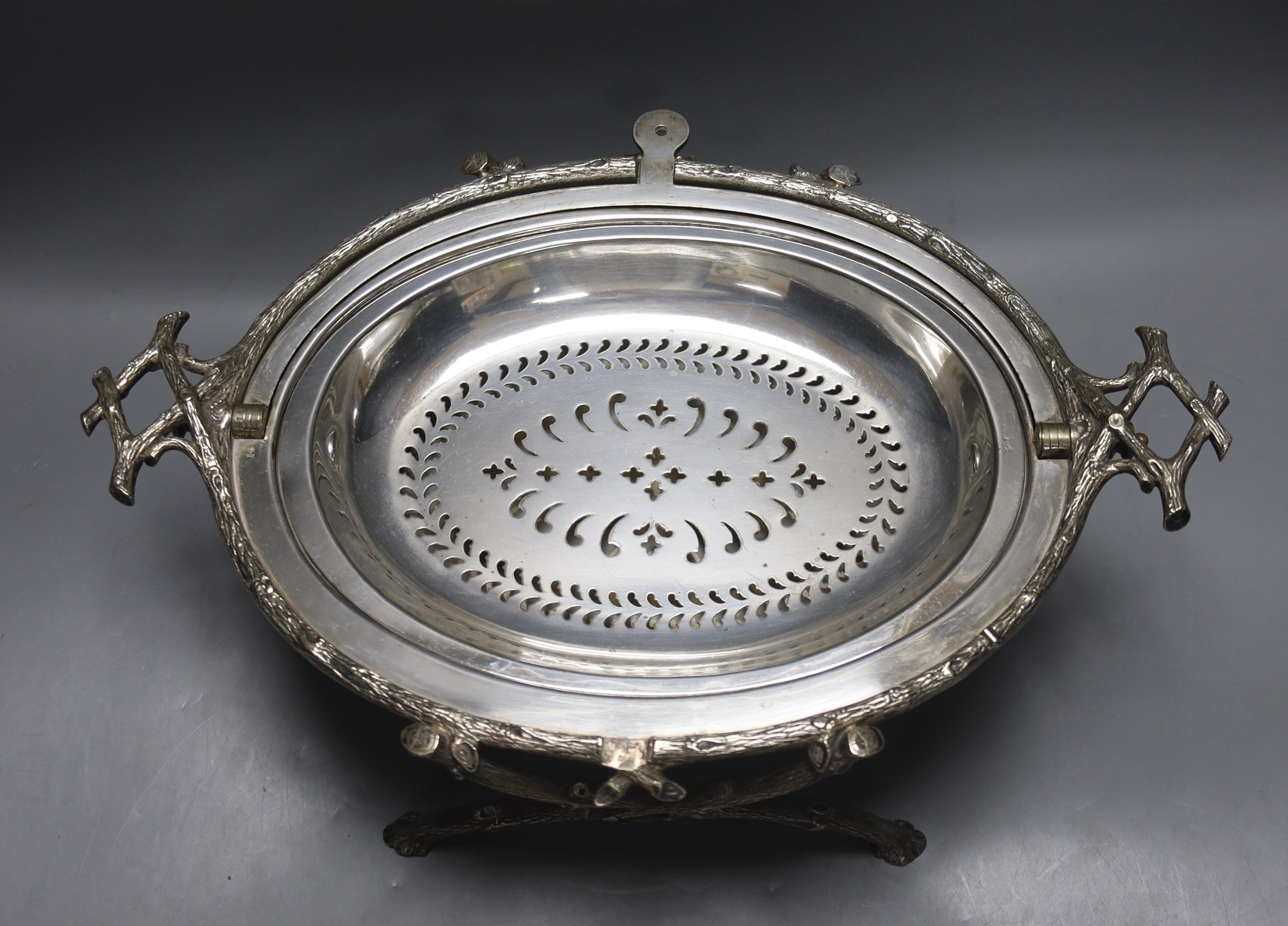 A pair of Victorian silver plated meat covers, 30cm and a similar roll-top breakfast dish (3)